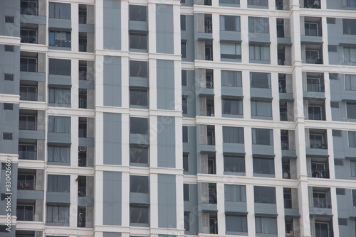 Big tall building background with windows and glass.