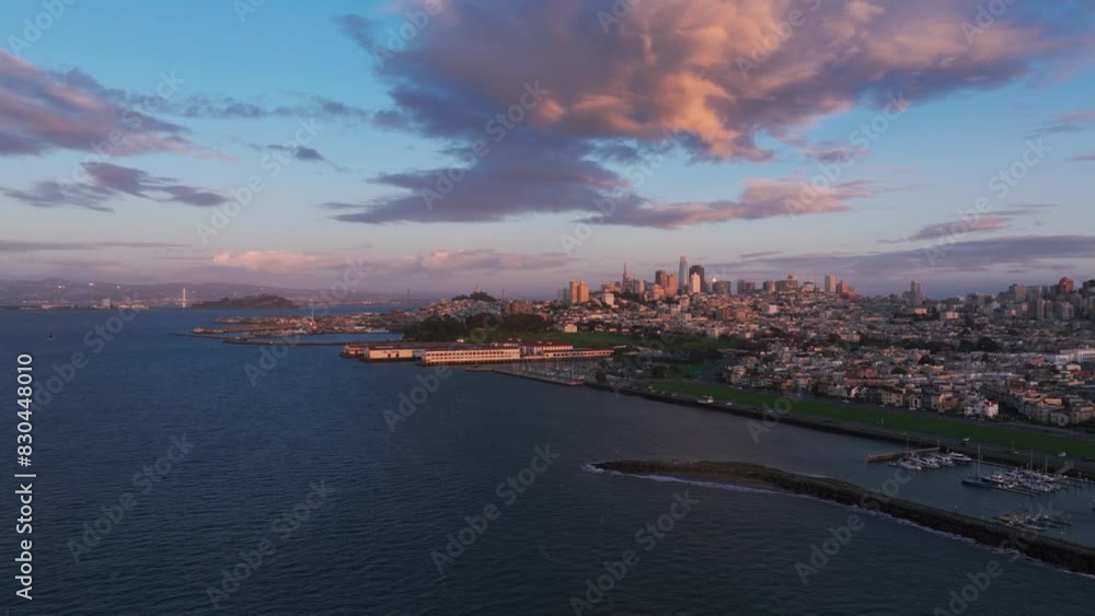 Drone aerial view of the harbors and ferry buildings in San Francisco at sunset