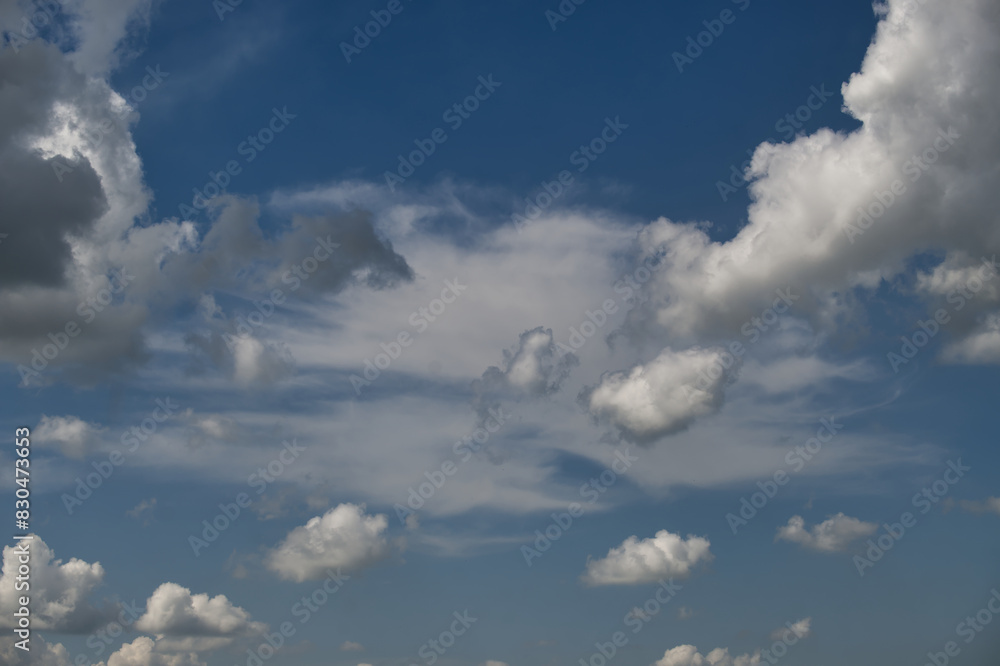 Beautiful clear blue sky with scattered fluffy white clouds Beautiful clear blue sky with scattered fluffy white clouds