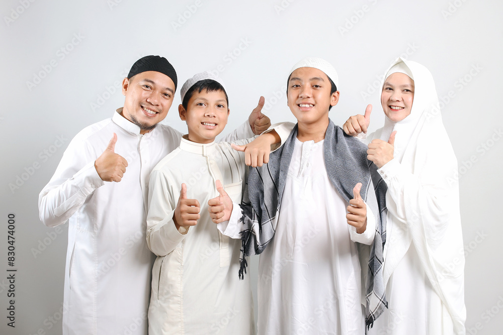 Happy Muslim Family Wearing Islamic Clothes Showing Thumbs Up With Happy Expression Happy Muslim Family Wearing Islamic Clothes Showing Thumbs Up With Happy Expression