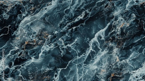 Close-up shot of natural marble texture showcasing intricate veins and subtle color variations. The timeless design exudes luxury and sophistication, making it perfect for a desktop wallpaper.