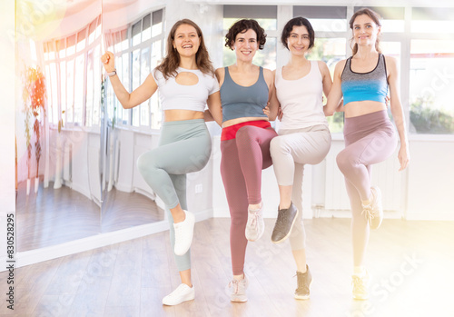 Group of girls with middle-aged woman couch perform Irish folk dance. Dance training from scratch, active leisure