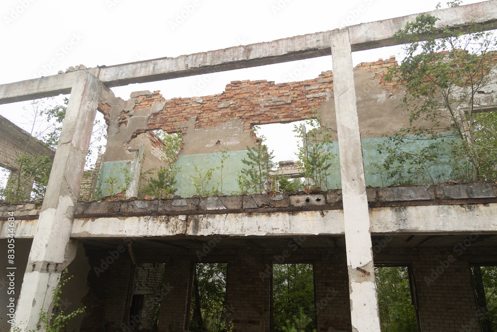 The ruins of building in old soviet army base in Latvia, Europe. Collapsed house. The ruins of building in old soviet army base in Latvia, Europe. Collapsed house.