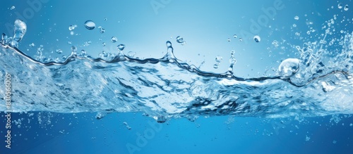 A vibrant close up image capturing the splashing of blue water providing ample space for text or other elements