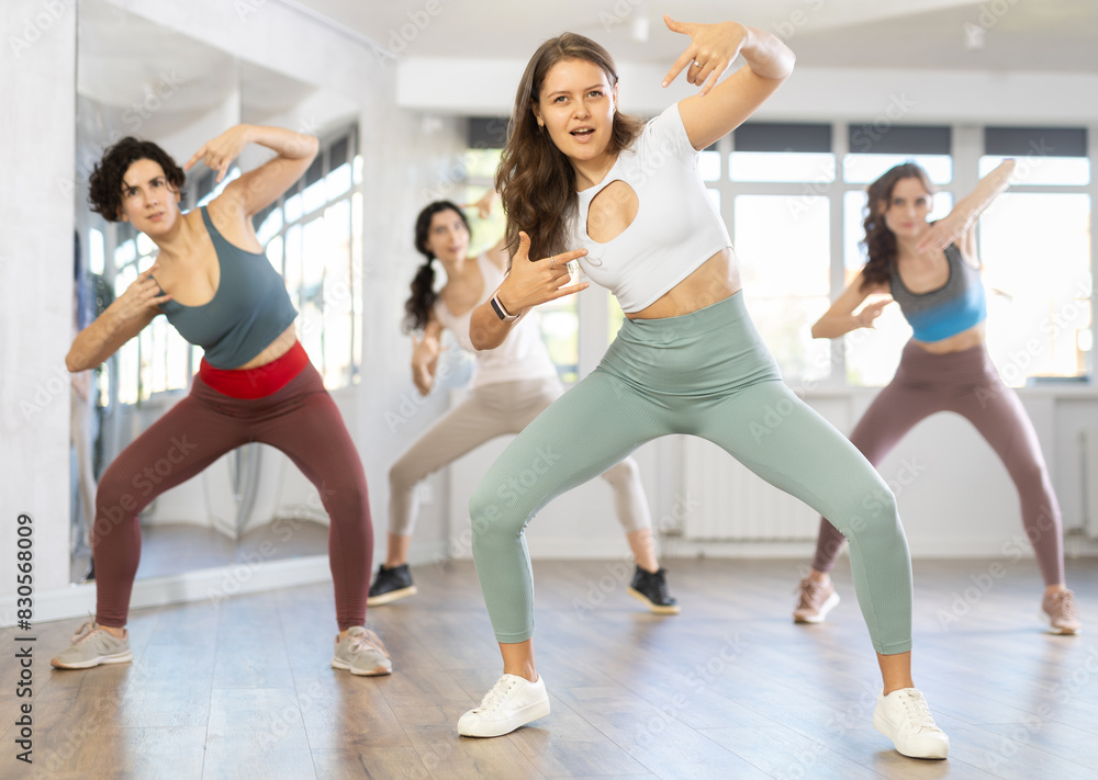 Group of women dancing energetic hip hop dance in studio