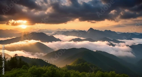 Billowing Clouds at Sunset Over the Undulating Mountains of Jiucaiping, Guizhou, China. Sunset Glow Enhances the Spectacular Scene as Clouds and Mists Roll and Relax Between the Peaks
 photo