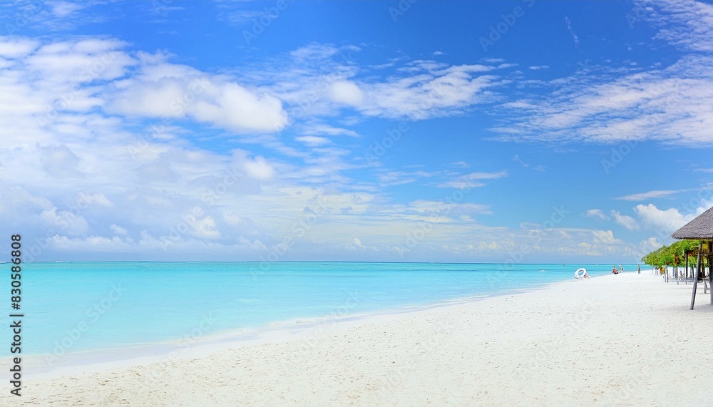 Obraz premium beautiful beach with white sand, clear blue water, and palm trees in the background. picturesque beach panorama, endless white sand, turquoise waves lapping the shore, beneath a vast blue sky