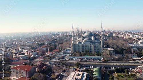 3+ Mosques Lined up in 1 shot. Iconic Blue Mosque in Istanbul, Turkey, with its majestic domes, minarets, lining up  the cityscape landmarks. Aerial drone footage, Istanbul, Turkey - İstanbul, Türkiye photo