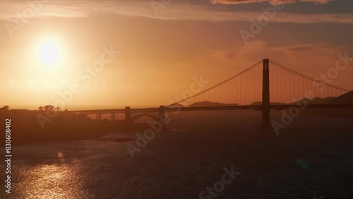 Sunset drone shot of the Golden Gate Bridge in San Francisco, California photo