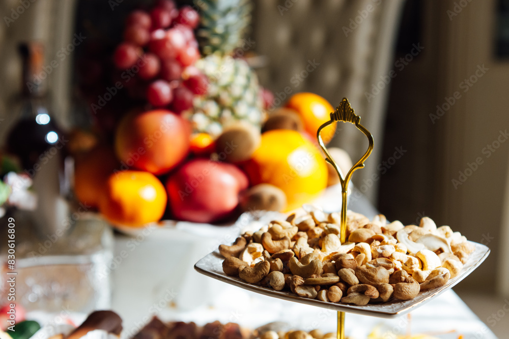 A large variety of fruits and vegetables on the table for guests A large variety of fruits and vegetables on the table for guests