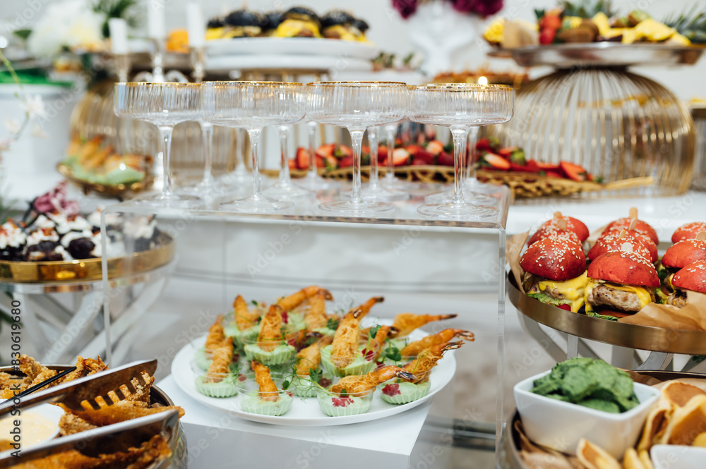 A wide variety of snacks on the table for guests. Shrimp, boiled pork, various types of meat and other products A wide variety of snacks on the table for guests. Shrimp, boiled pork, various types of meat and other products