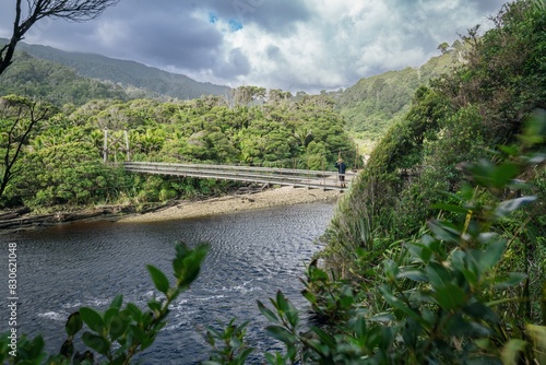 Hiking trail bridge crossing the Kohaihai River on Heaphy Track, Karamea, West Coast, New Zealand. photo