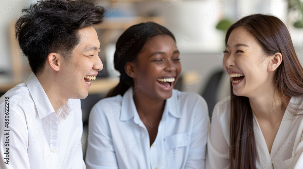 Diverse Group of Friends Laughing Joyfully in a Casual Setting Diverse Group of Friends Laughing Joyfully in a Casual Setting