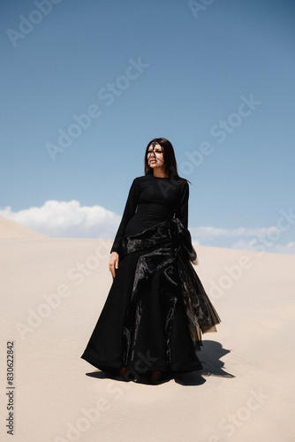 girl in a designer dress in the desert, girl in the desert in a black dress
