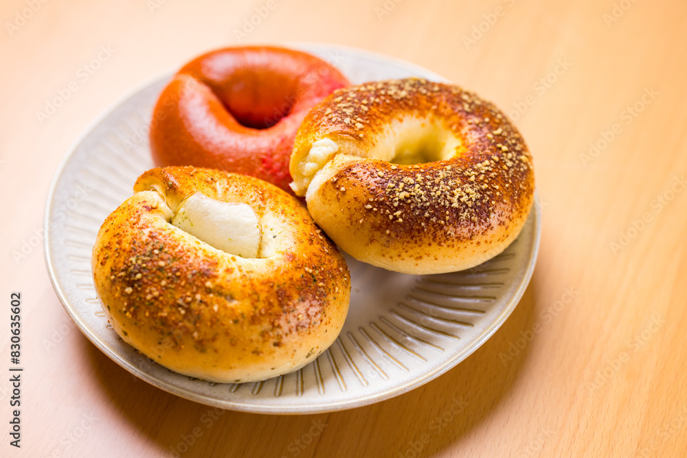 Assorted homemade bagel on the plate Assorted homemade bagel on the plate