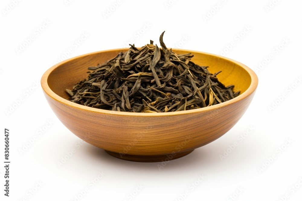 A dried kelp flakes in a small bowl on a white background A dried kelp flakes in a small bowl on a white background