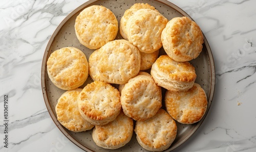 soft homemade biscuits arranged on a platter seen from above, closeup