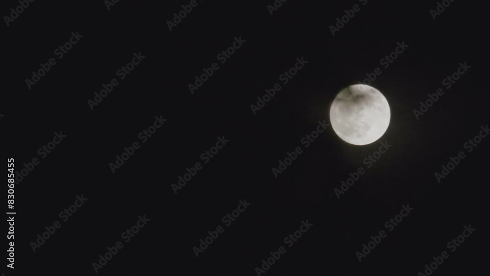 Establishing shot of a full moon at night Establishing shot of a full moon at night