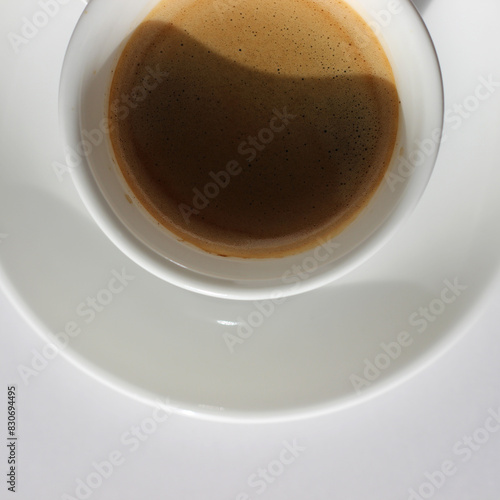 Closeup Espresso Shot with Crema on White Background. Cafe.