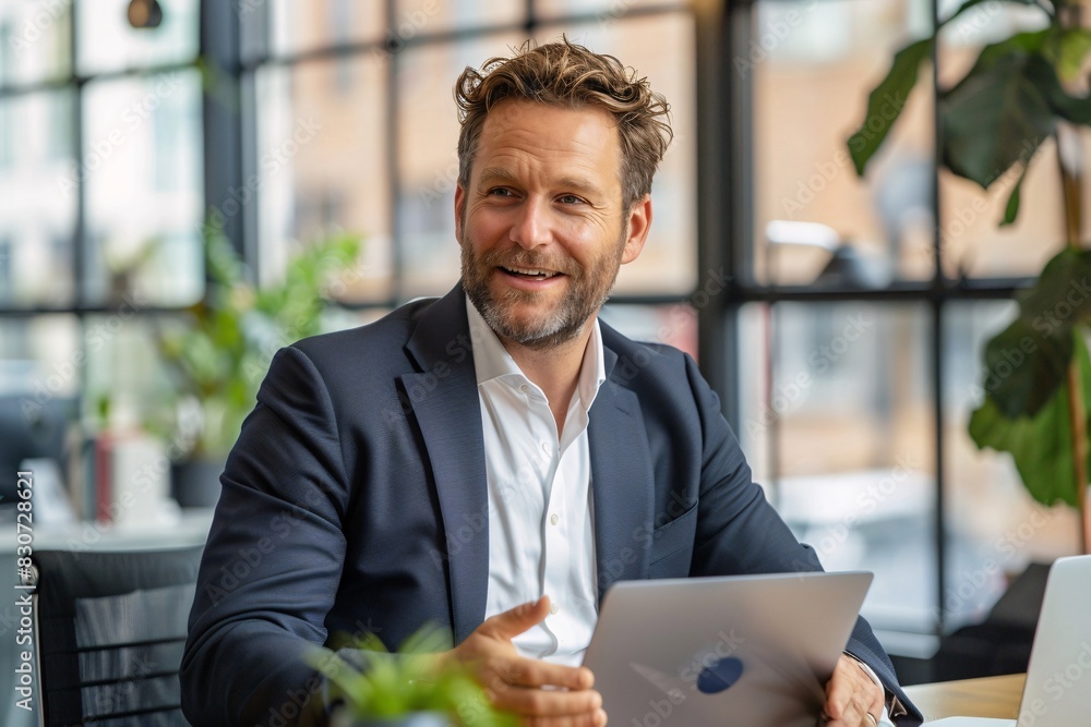 Successful Businessman Posing for a Professional Photo in an Office Setting Successful Businessman Posing for a Professional Photo in an Office Setting