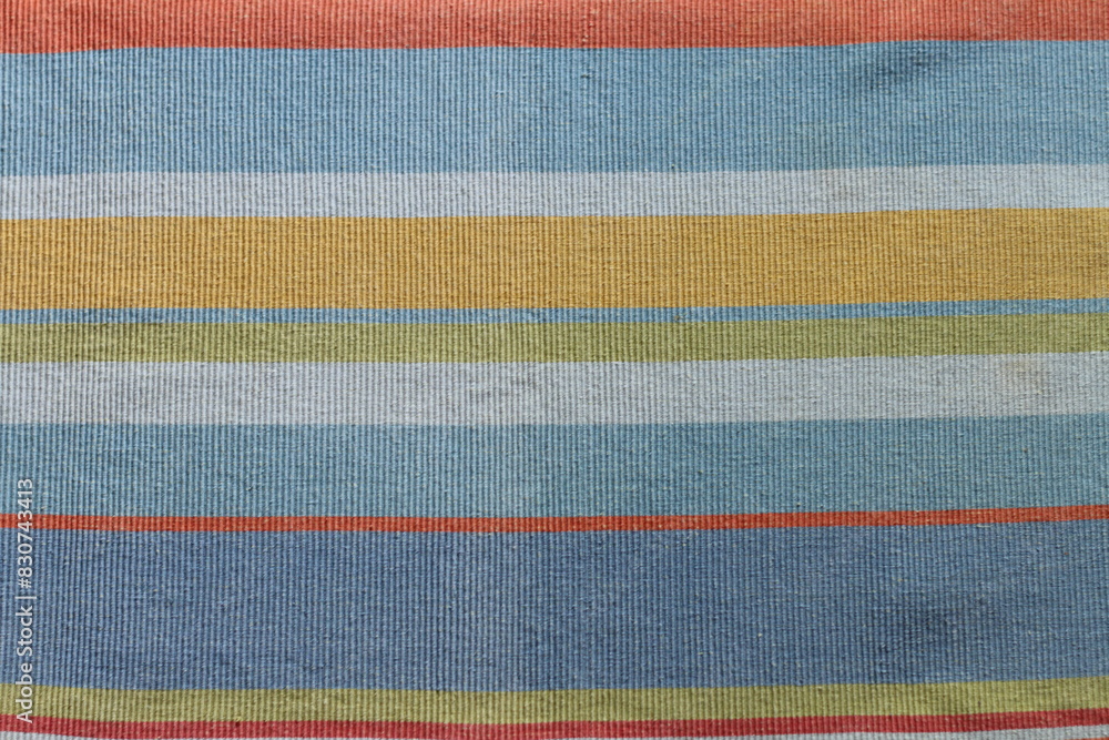 Texture of textile with striped pattern of pastel colors