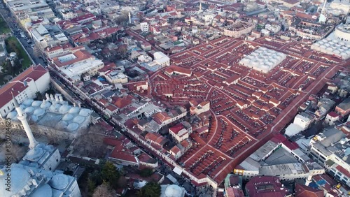 Grand Bazaar and Spice Bazaar Markets, between Beyazit and Nuruosmaniye Mosque in Istanbul, Turkey. Drone Aerial circles in a wide shot from above. İstanbul, Türkiye. Kapalıçarşı, Büyük Çarşı photo