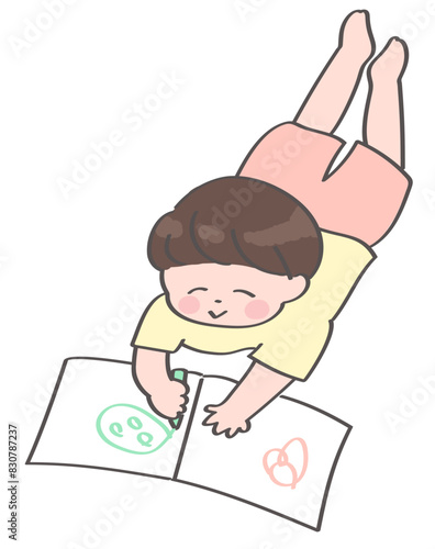 うつ伏せでお絵かき帳に絵を描く男の子のイラスト