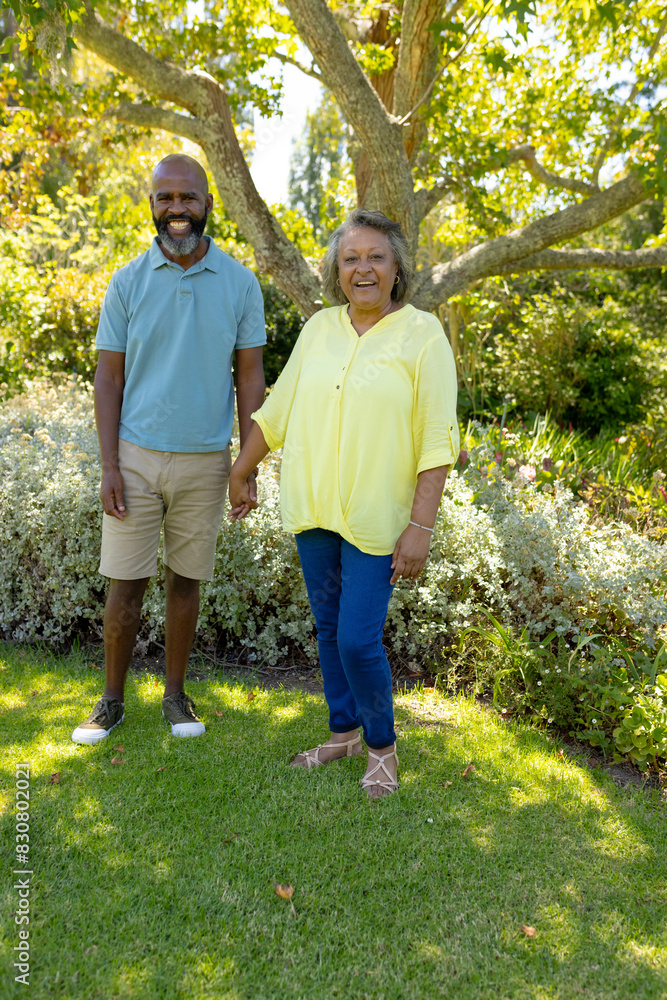 A diverse senior couple enjoying outdoors, wearing casual summer clothes A diverse senior couple enjoying outdoors, wearing casual summer clothes