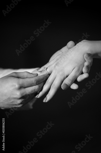 Bride and groom hands with wedding ring