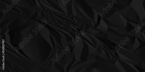 Black crumpled paper texture . Wrinkled paper texture. Black paper texture . Black crumpled and top view textures can be used for background of text or any contents .