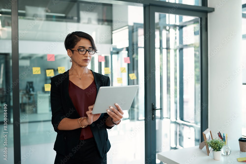 Fototapeta premium Businesswoman, office and tablet for browsing with glasses in corporate company for research with tech. Internet, online and stock market with accountant in modern firm for digital accounting.