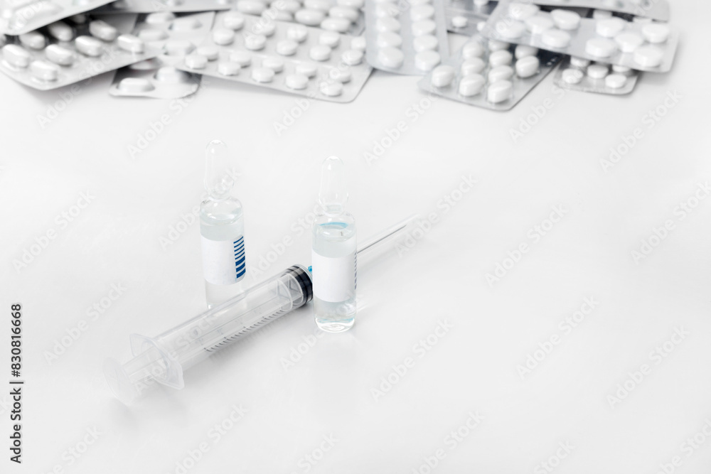 Medications and infection to prevent a pandemic virus. Pills, masks on white isolated background. Flat lay Top view with copy space for your text. Medications and infection to prevent a pandemic virus. Pills, masks on white isolated background. Flat lay Top view with copy space for your text.