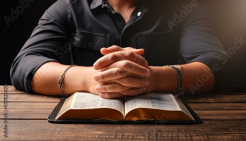 Man praying with the Bible - Reading the Holy Book of Christianity - Praying out of Faith and Believe in God - Christian Male during Bible Studies - Praying for salvation and Desperation