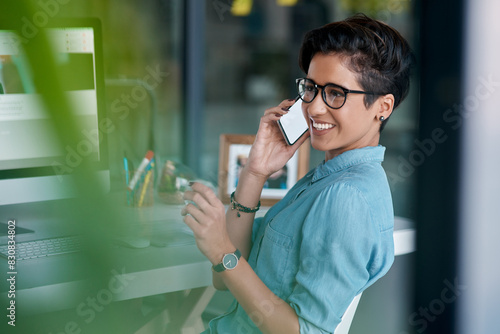 Creative, girl and phone call with smartphone in office for communication on website development and project management. Female designer, conversation and online for app updates, feedback and ideas. © peopleimages.com