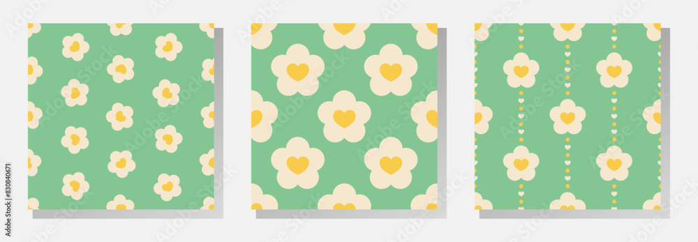 White and yellow flowers and hearts on green background. Vector seamless patterns collection in soft retro pastel colors. White and yellow flowers and hearts on green background. Vector seamless patterns collection in soft retro pastel colors.