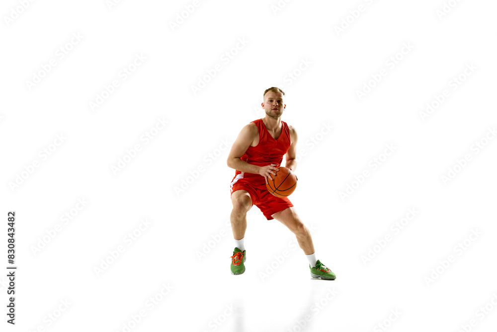 Young athletic man, basketball sportsman dressed red uniform training in motion against white studio background. Concept of professional sport, games, healthy lifestyle, tournament, action. Ad Young athletic man, basketball sportsman dressed red uniform training in motion against white studio background. Concept of professional sport, games, healthy lifestyle, tournament, action. Ad