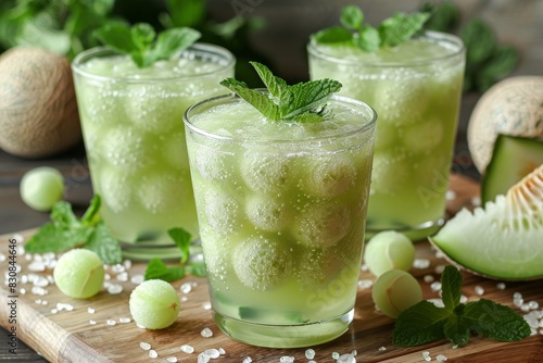 Melon Mint Smoothie - Pale green with melon balls and mint.