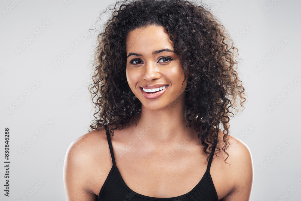 Woman, smile and hair care in studio with pride for salon treatment, growth and satisfaction. Happy, female person and relax with confidence for shampoo, shine and curly hairstyle on white background Woman, smile and hair care in studio with pride for salon treatment, growth and satisfaction. Happy, female person and relax with confidence for shampoo, shine and curly hairstyle on white background