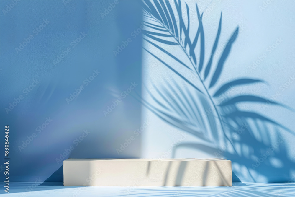 Beige stone platform on blue wall with beautiful palm tree shadows Beige stone platform on blue wall with beautiful palm tree shadows