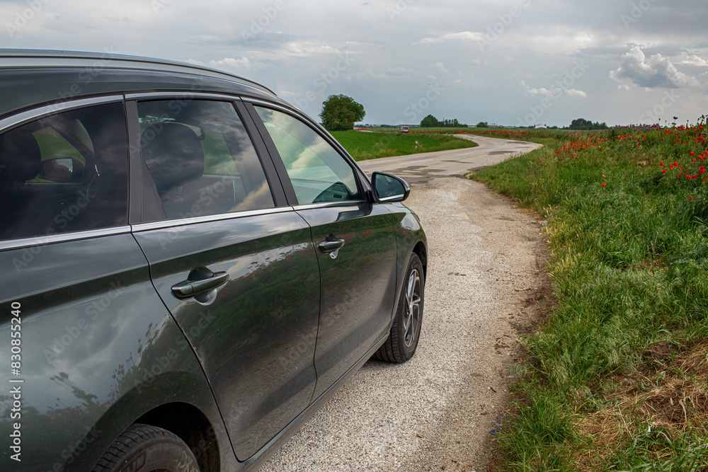 Car on the country road surrounded by nature. Car on the country road surrounded by nature.