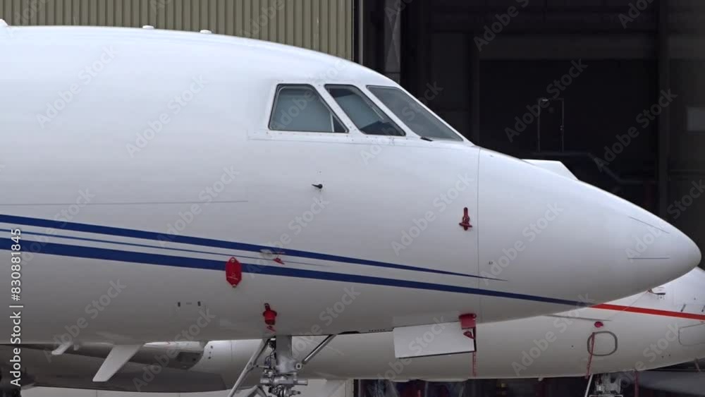 Private Business Corporate Executive Jet Parked at Airport - close up Private Business Corporate Executive Jet Parked at Airport - close up