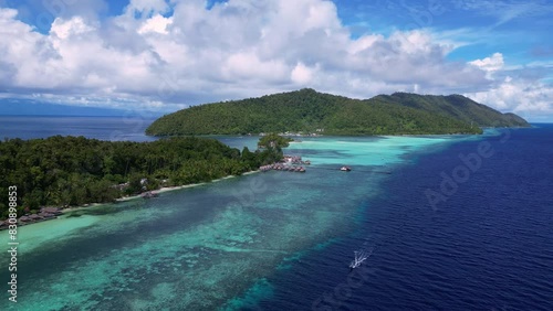 Raja Ampat, Indonesia: Aerial drone footage in the famous Raja Ampat archipelago with the Kri and Mansuar islands surrounded by a massive coral reef in West Papua in Indonesia.  photo