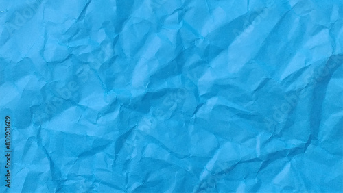 Blue background and wallpaper by crumpled paper texture and free space.