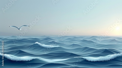 A single seagull flies over a vast, blue ocean with white capped waves. The horizon is a hazy gray, suggesting a calm, peaceful day. photo