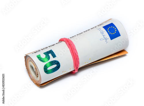 Concept of many euros: a pile of rolled 50-euro bills lying on a white background 1