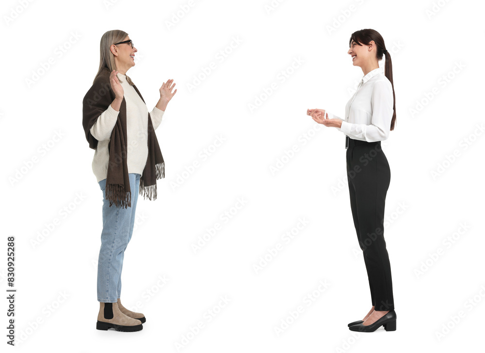 Two women talking on white background. Dialogue Two women talking on white background. Dialogue