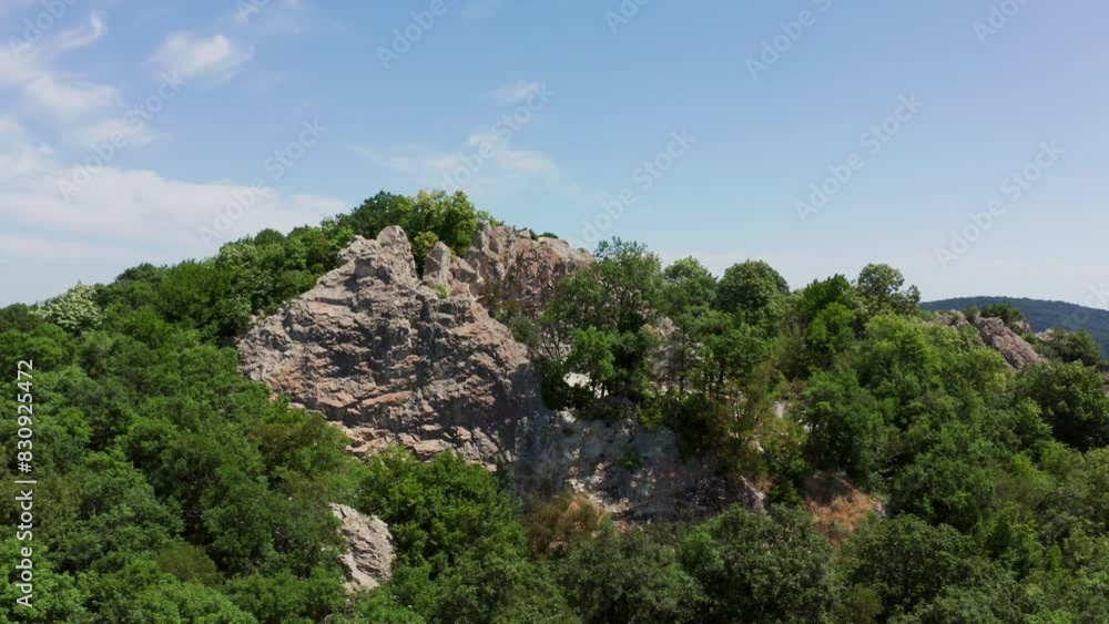 Ancient Thracian Necropolis The Deaf Stones With Vegetation Near Ivaylovgrad, Bulgaria. orbiting drone shot Ancient Thracian Necropolis The Deaf Stones With Vegetation Near Ivaylovgrad, Bulgaria. orbiting drone shot