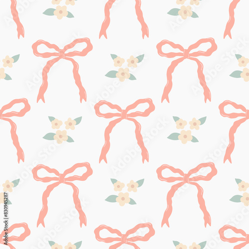 Cute seamless pattern with pink ribbon bows and small flowers.