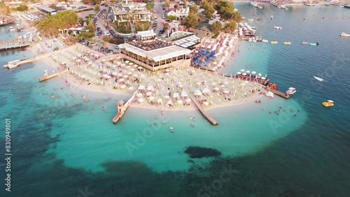 Amazing peninsula adorned with elegant hotels and beaches of azure Ionic sea of Ksamil beach Albania photo