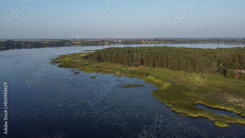 aerial view of Khrinnyky water reservoir  lake or swamp  with field and forest